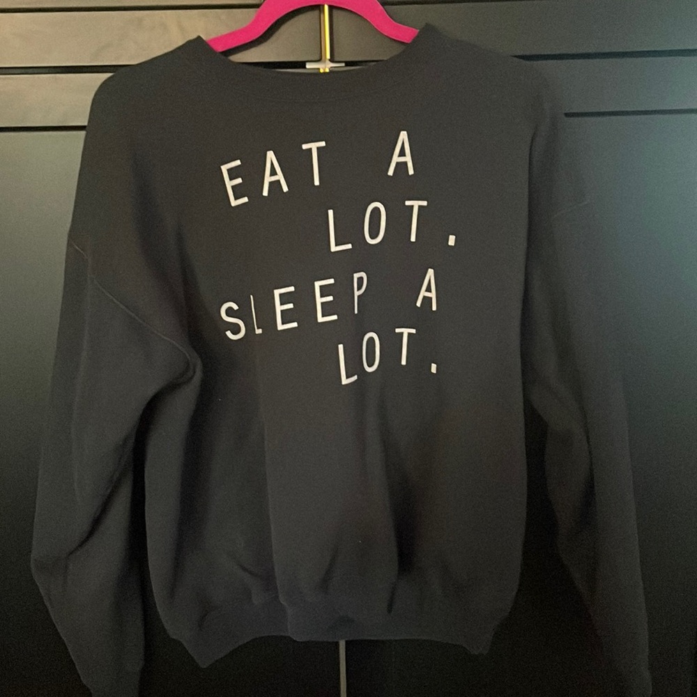 Black crew neck. Eat a lot. Sleep a lot.